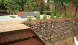 gabion retaining wall wooden deck metal stairs