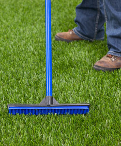 image of brushing artificial grass