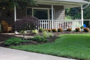 Landscape design idea for the front of a house.