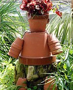 Make your own garden art with terracotta pots and a plant.