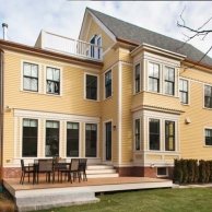 remodeled exterior with simple deck in side yard of the renovated this old house tv cambridge project,  deck designs inspirational ideas